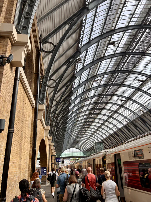 A train waiting beneath the arched roof of London King’s Cross station