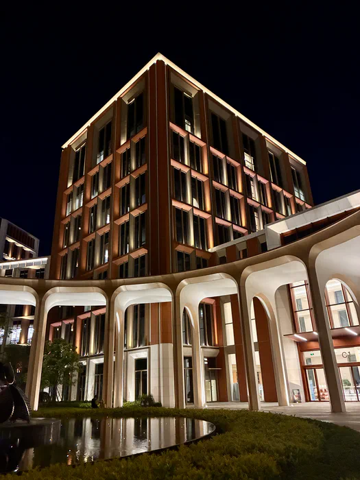An illuminated building at Huawei’s Lianqiu Lake campus at night